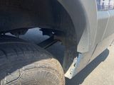 a close up of a flat tire on a truck