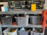 many bins on the shelves in the garage