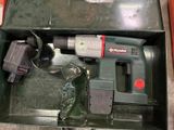 a box with a drill and other tools inside of it