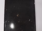 a black laptop computer sitting on a white table