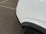 a white truck that is parked in a parking lot