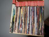 a lot of children ' s books in a wooden box