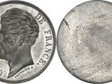 a close up of a coin on a white background