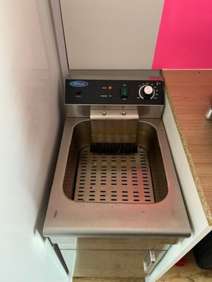 an image of a kitchen with a sink and a dishwasher