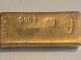 a gold bar sitting on top of a white counter top