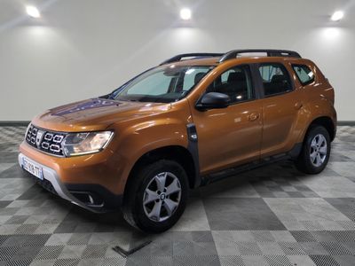 a picture of a brown dacia parked in a garage