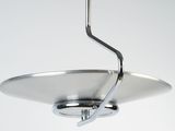 a metal object hanging from the ceiling in a room