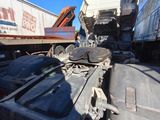 a truck that has been flipped over on the side of the road