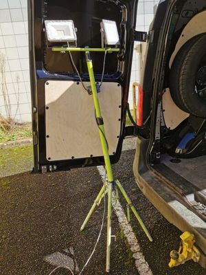 a car that has a small tripod in the back of it