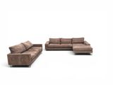 two brown couches and a chair on a white background