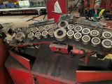 a picture of a machine that is working on a piece of machinery