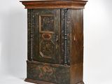 a wooden cabinet with a door on the top of it