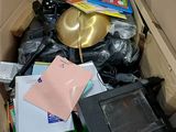 a cardboard box filled with electronic equipment and other items