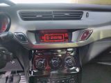 a car dashboard with a digital display in the center