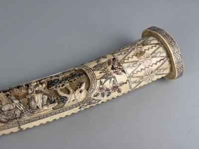 a very large ivory colored object with a design on it