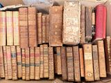 a box full of old books sitting on a table