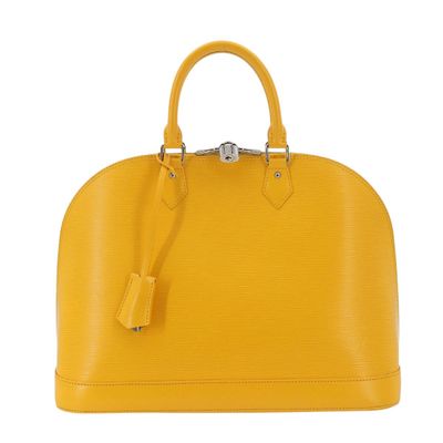 a yellow handbag on a white background