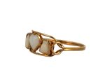 a close up of a gold ring with two oplite stones