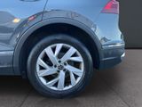 a close up of a car ' s tire on the ground
