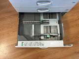 a machine that is sitting on the floor with its door open