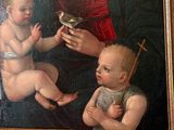 a painting of a woman holding a baby and a bird