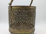 an old brass metal basket with handles and handles
