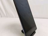 a tablet that is sitting on a stand on the table