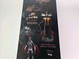 the dark man action figure is in the box