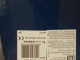 the back of a blue box with a barcode on it