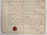 un gros plan d'une feuille de papier portant un cachet de cire