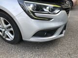a close up of a car ' s headlight and front bumper