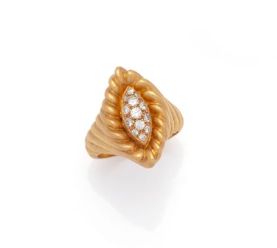 a gold and diamond ring, by van cleef