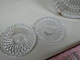 three glass plates sitting on a white counter top