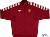 a red jacket with white stripes and a crest on the front