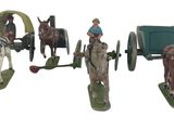 trois figurines représentant des chevaux tirant un chariot et un homme dans une calèche