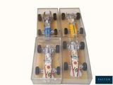 four toy race cars in a box on display