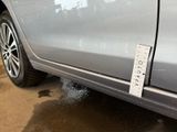 a sticker on the side of a car that has a sticker attached to it