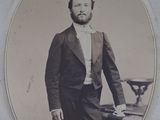 an old photo of a man in a suit and tie