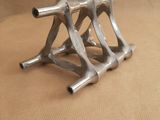 three metal objects that are sitting on a table