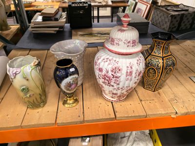 many different vases on a table in a store