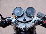 a close up of a motorcycle with a speedometer and gauges