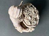 a sculpture of a snail with a shell on it ' s back