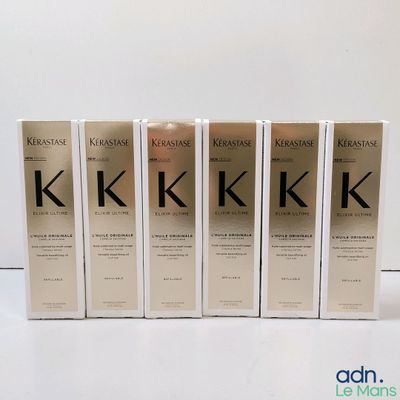 quatre boîtes de produits capillaires Kerassene posées sur une surface blanche
