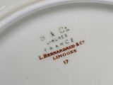 a close up of a white plate with red writing on it