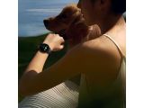 a woman that is holding a dog in her arms
