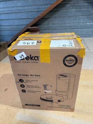 packaging of a boxed coffee maker sitting on top of a cardboard box