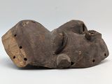 a close up of a wooden object with holes in it