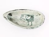 a spoon with a drawing of a bird on it
