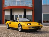 a yellow sports car parked in front of a building