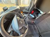 a steering wheel and dashboard of a bus